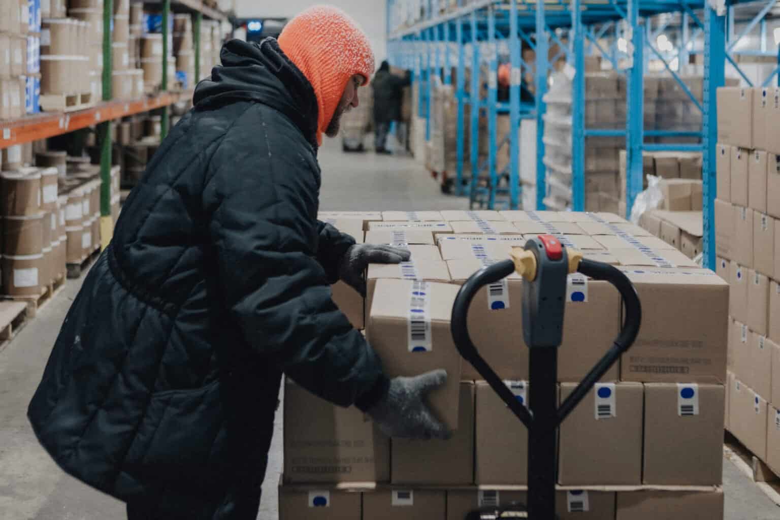DeConna Ice Cream Wholesale Distribution Warehouse - DeConna Ice Cream Worker moving cases of frozen ice cream through the DeConna distribution warehouse