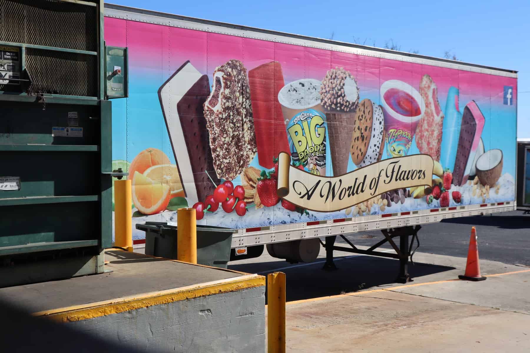 DeConna World of Flavors — Ice Cream Bars, Cones, Sandwiches & Cups - DeConna Ice Cream Side of a DeConna semi truck showing the A World of Flavors wrap with ice cream bars, sundae cones, sandwiches, cups and Italian ice